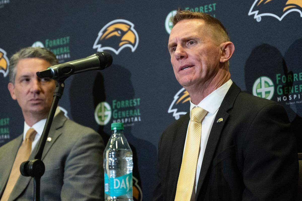 Southern Mississippi head coach Blake Anderson (right) answers questions Monday at an introductory news conference in Hattiesburg.