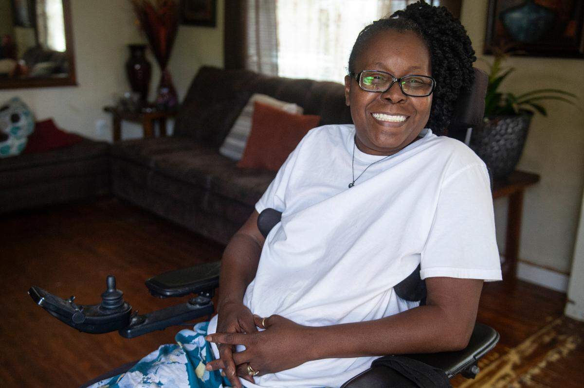 Antrease Bullock poses for a portrait at her home in Gulfport on Monday, June 10, 2024. Bullock, who is paralyzed from the waist down, will finally be getting a safe wheelchair ramp installed at her home after not having a safe way to leave the house since she was shot in 2019.