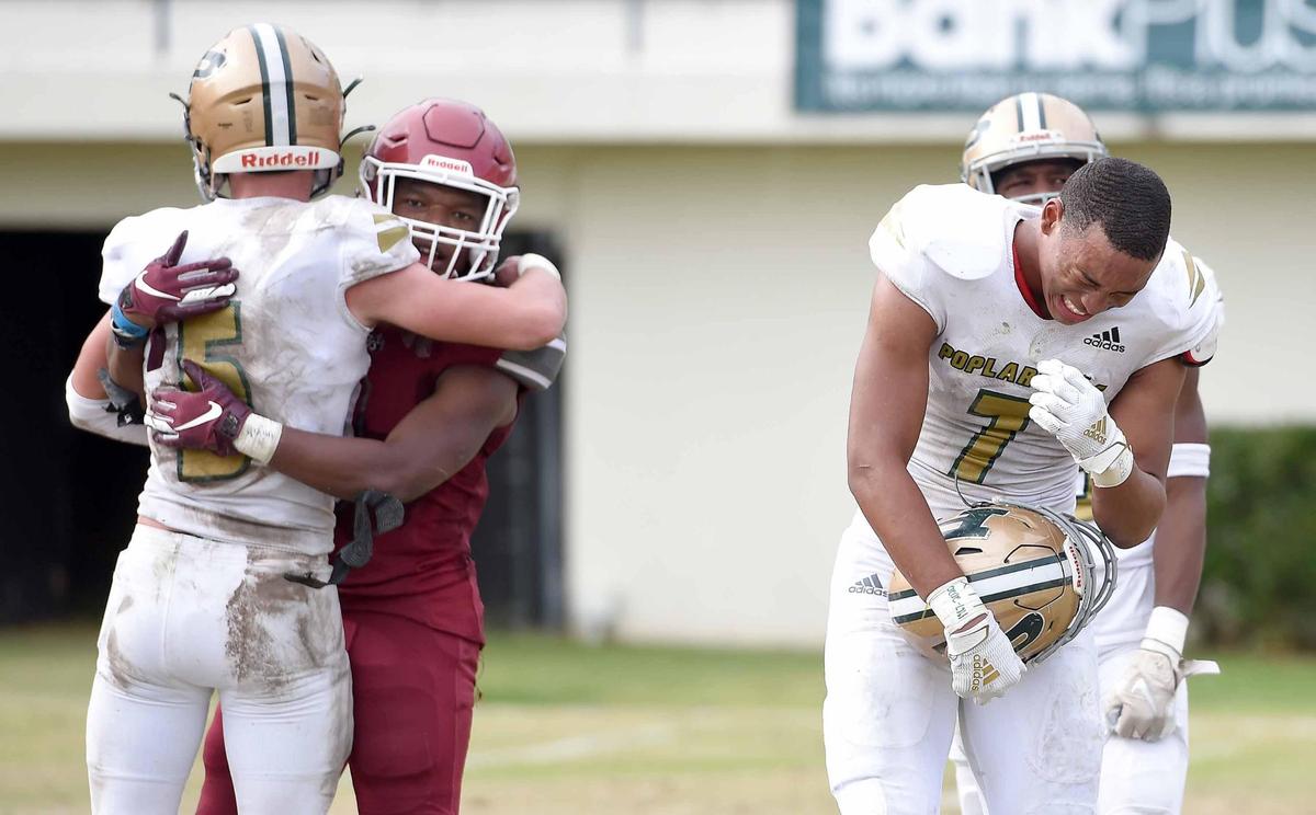 Poplarville’s Torry Polk (5) and Khalid Moore (7) show dejection after losing to Louisville in the MHSAA Class 4A State Football Championship on Saturday, December 5, 2020, at Mississippi Veterans Memorial Stadium in Jackson, Miss.