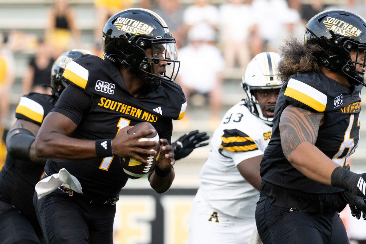 Southern Miss quarterback Braylon Braxton (1) runs out of the pocket during a football game at M. M. Roberts Stadium on Saturday, Sept. 13, 2025. The Golden Eagles won 38-22.
