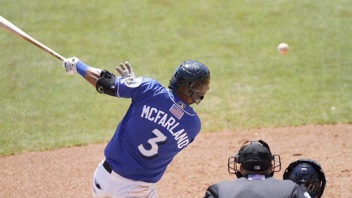 TIM ISBELL/SUN HERALD 
 Biloxi's Chris McFarland hits a shot up the middle during game against Pensacola at MGM Park, Wednesday, Apr. 20, 2016.