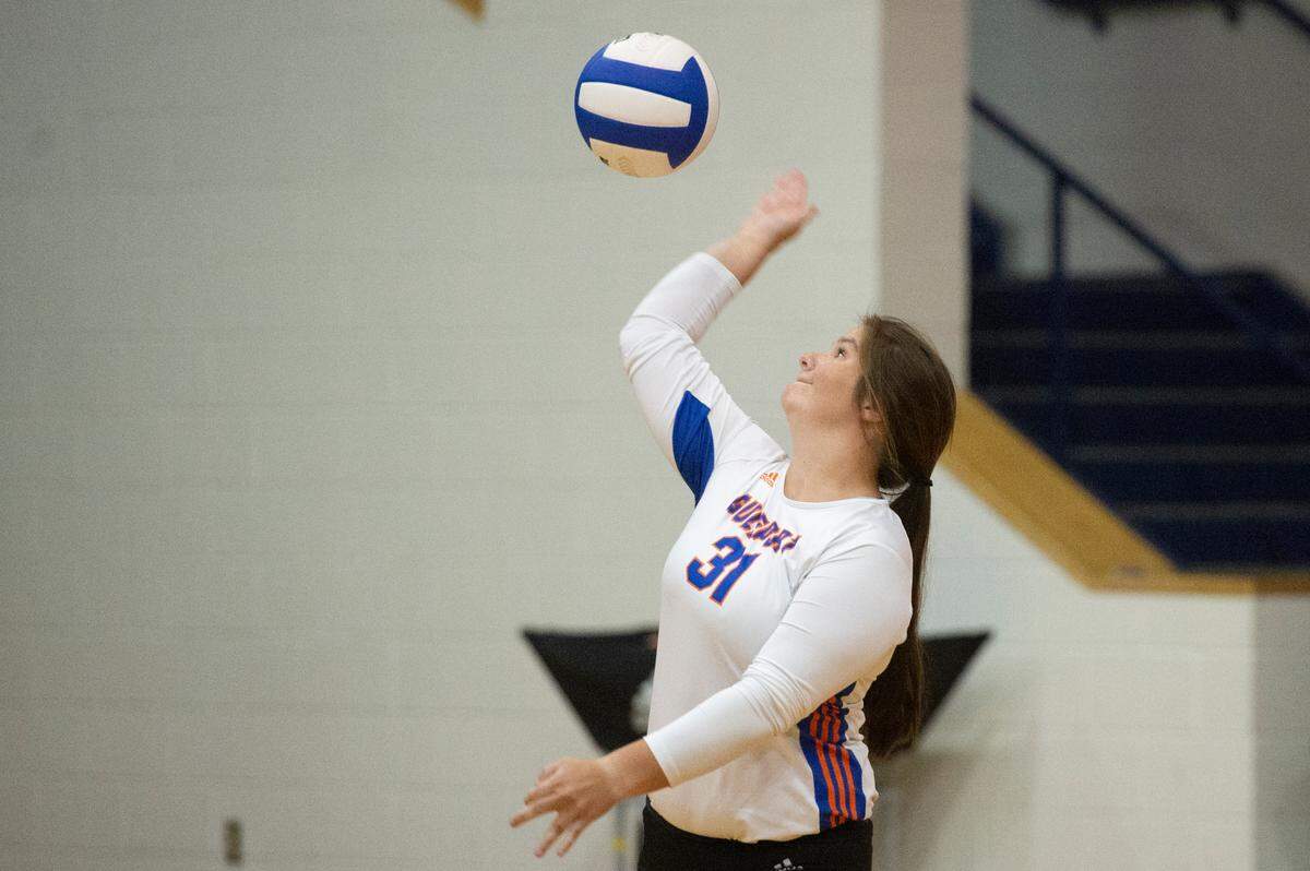 Gulfport’s Caroline Lindsey serves the ball during a volleyball match against Ocean Springs at Gulfport High School in Gulfport on Tuesday, Oct. 4, 2022.