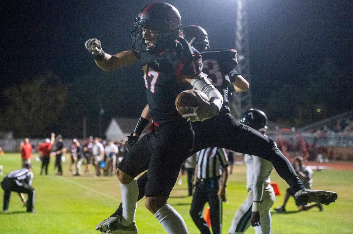 St. Stanislaus’ Levi Green and Jackson DiCerbo celebrate after a touchdown during a playoff game against Port Gibson at St. Stanislaus in Bay St. Louis on Friday, Nov. 4, 2022.