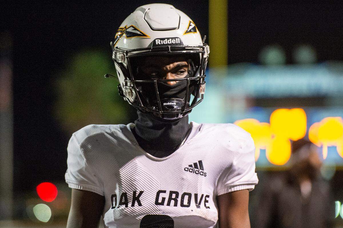 Oak Grove quarterback Aj Maddox reacts after losing a 6A playoff game to Ocean Springs at Greyhound Stadium in Ocean Springs on Friday, Nov. 18, 2022.