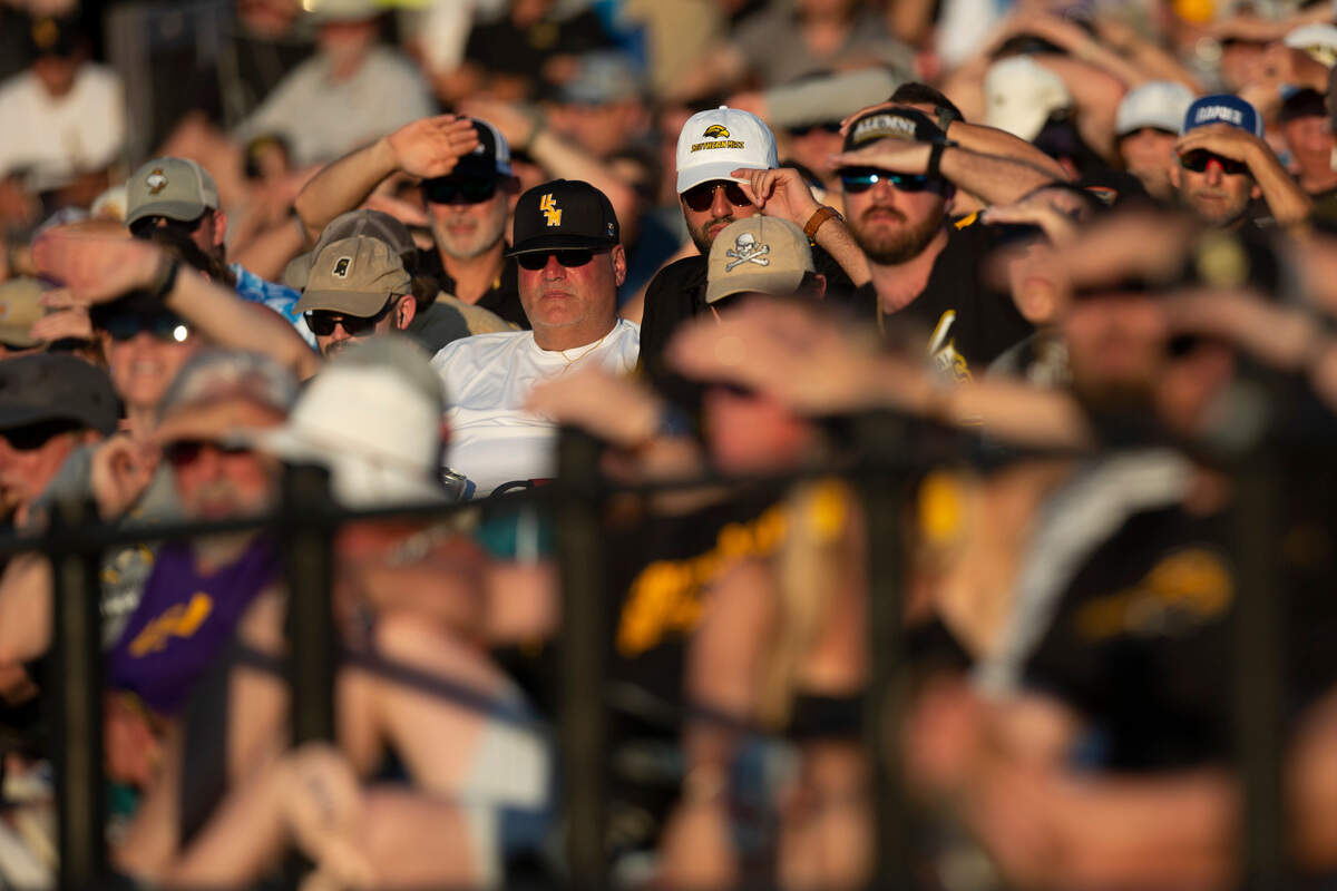 Fans shield their eyes to the sun during Game Four of NCAA Regionals at Pete Taylor Park in Hattiesburg on Saturday, June 4, 2022.