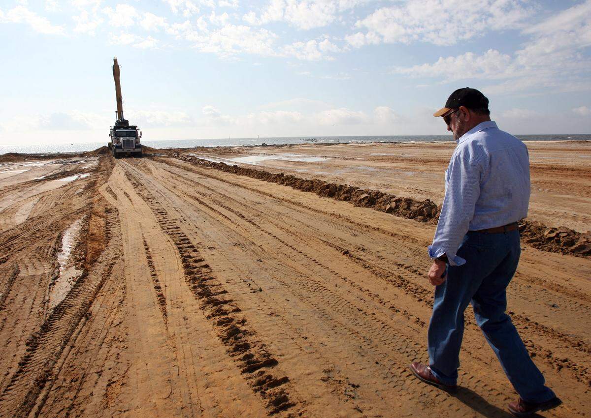 W. C. “Cotton” Fore walks along the west pier of the State Port at Gulfport in 2009. The port added to the southwestern portion, creating more land for potential use. Fore’s company was involved in numerous port expansion projects.