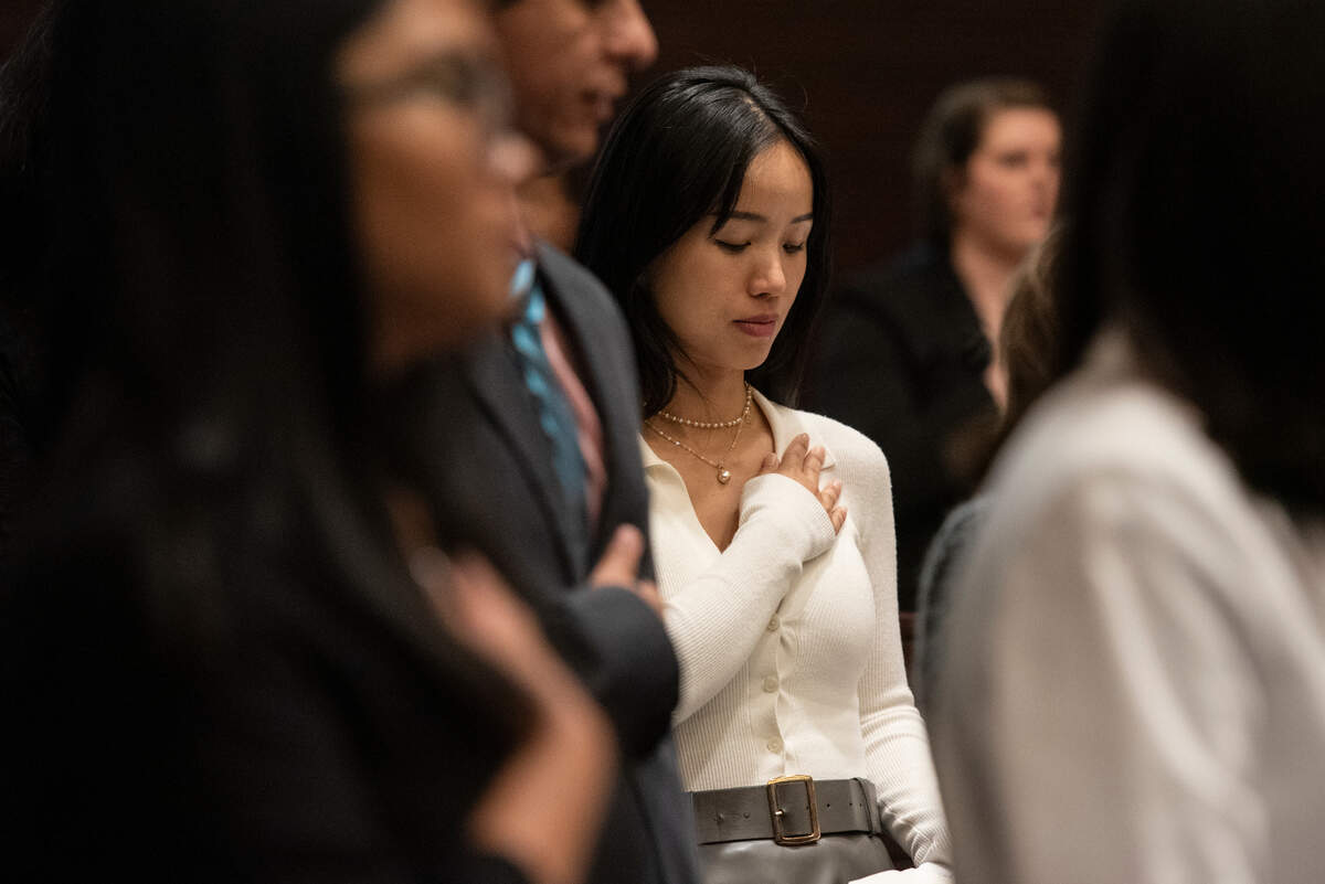 Newly naturalized American citizens do the pledge of allegiance during a naturalization ceremony at Dan M. Russell Courthouse in Gulfport on Thursday, Oct. 19, 2023.