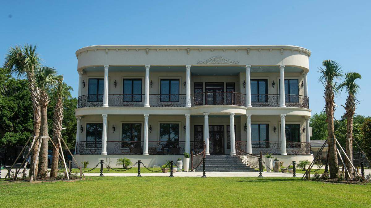The home of Binoy and Abha Mishra on Scenic Drive in Pass Christian on Tuesday, May 16, 2023. The Mishras designed the Greek Revival home with great attention to detail, from the iron gates and railings to the granite floor tiles imported from India.