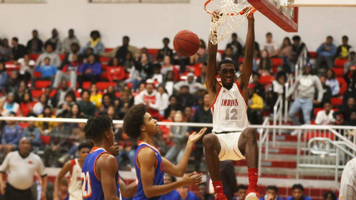 Biloxi senior Caleb McCarty slams in a dunk against Gulfport December 13, 2019.