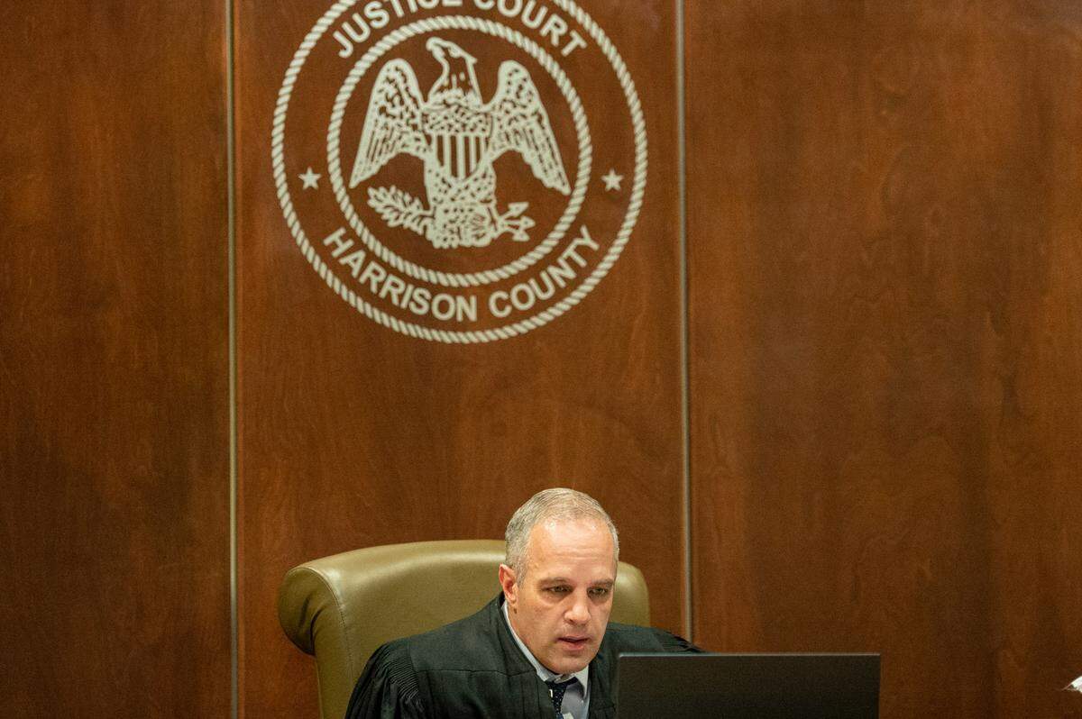 Judge Brandon Ladner talks with witnesses and defendants over a zoom call during an initial hearing for three men, who are charged with murder at a residence in Gaston Point over New Year’s Eve, at Harrison County Justice Court in Gulfport on Wednesday, Jan. 19, 2022.