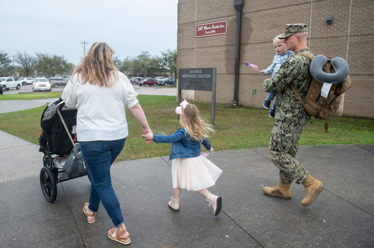 Members of Naval Mobile Construction Battalion 133 reunite with their families after returning from deployment at a homecoming event at the Naval Construction Battalion Center in Gulfport on Tuesday, March 5, 2024.