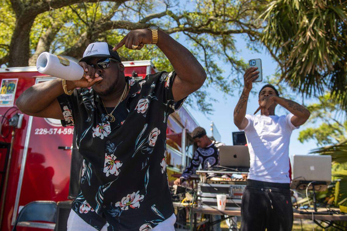 Spring breakers dance to a DJ playing off of Highway 90 during Black Spring Break in Biloxi on Saturday, April 9, 2022.