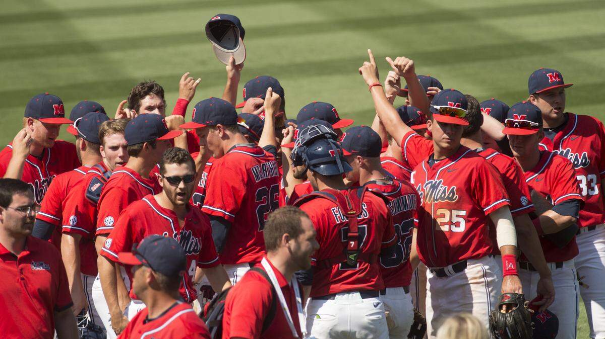 Mississippi players celebrate after defeating Georgia, 5-1, in the first round of the Southeastern Conference NCAA college baseball tournament in Hoover, Ala., Tuesday, May 24, 2016. (Vasha Hunt/AL.com via AP) MANDATORY CREDIT