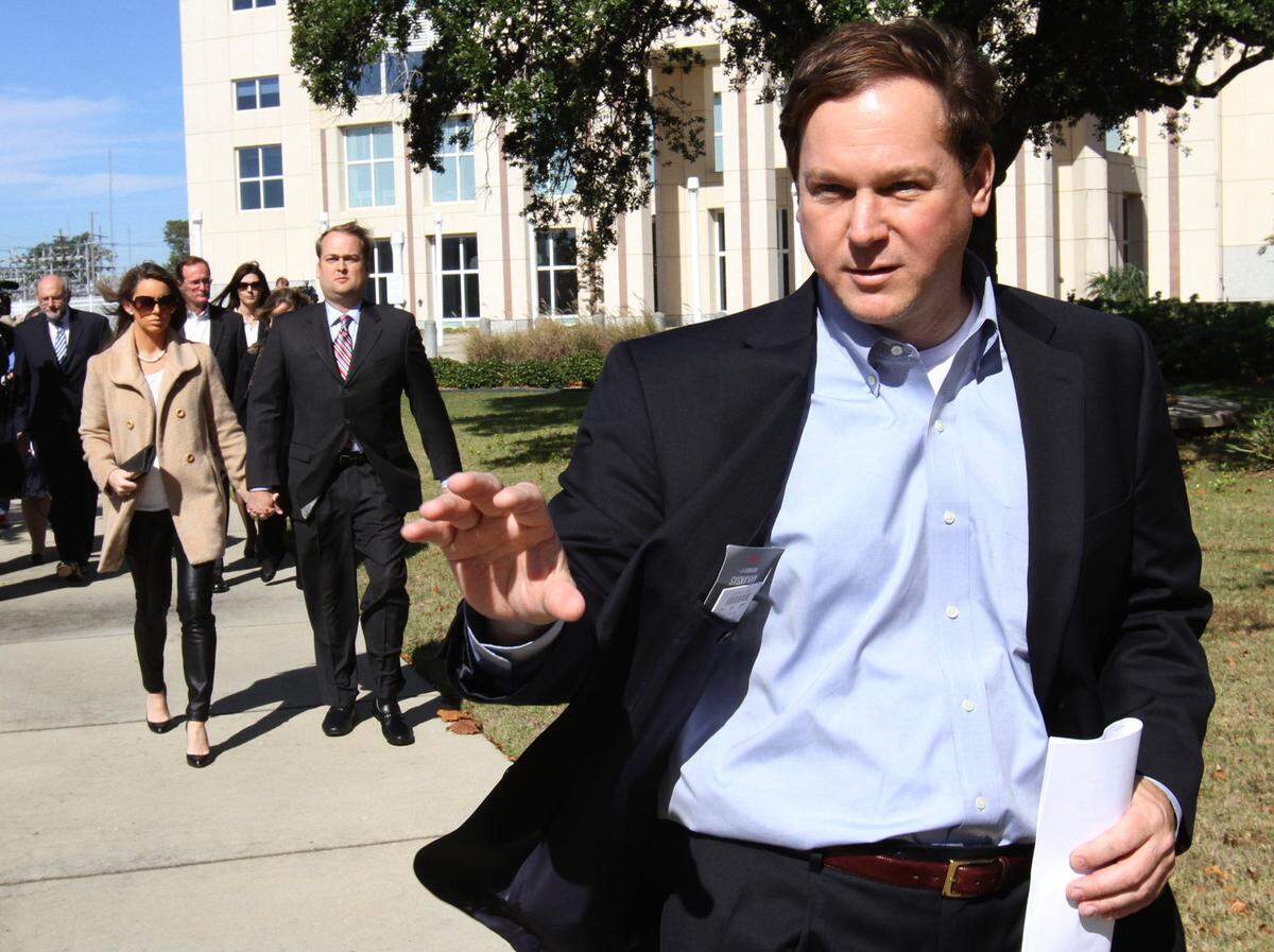 Former D’Iberville city manager Michael Janus leaves the Dan M. Russell Jr. federal courthouse in Gulfport after his initial appearance on Friday Nov. 8, 2013.