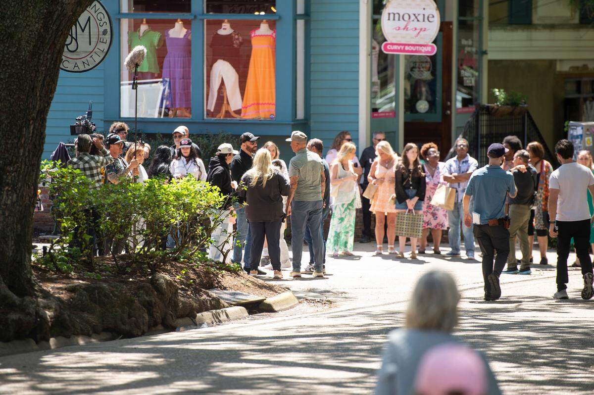 The cast and crew of Cash Out 3 during filming on Washington Avenue in Ocean Springs on Tuesday, April 8, 2025.