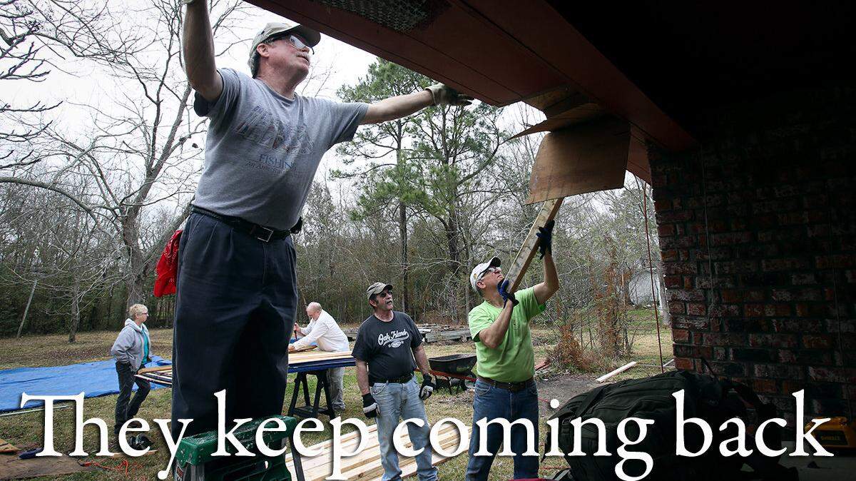 AMANDA McCOY/SUN HERALD
Sam Smalls, center, helps to re-roof a home in Pascagoula while on his 25th volunteer trip to South Mississippi since Hurricane Katrina.