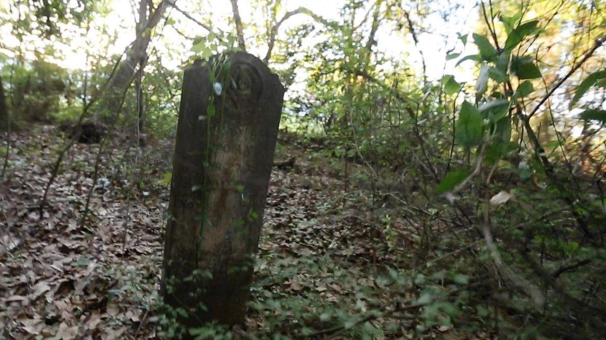 Only one headstone still stands in the Wells-Mulholland cemetery in a patch of woods in D'Iberville near the Promenade shopping center. Ghost stories, however, have risen from the cemetery.