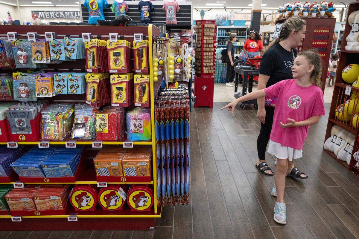 Customers shop for Buc-ee’s merchandise as the popular travel stop opened its first Mississippi location in Harrison County on Monday, June 9, 2025.