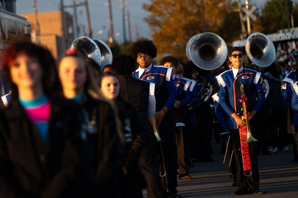Gulfport band members get ready before the Champions Christmas Parade in Gulfport on Monday, Dec. 8, 2025.
