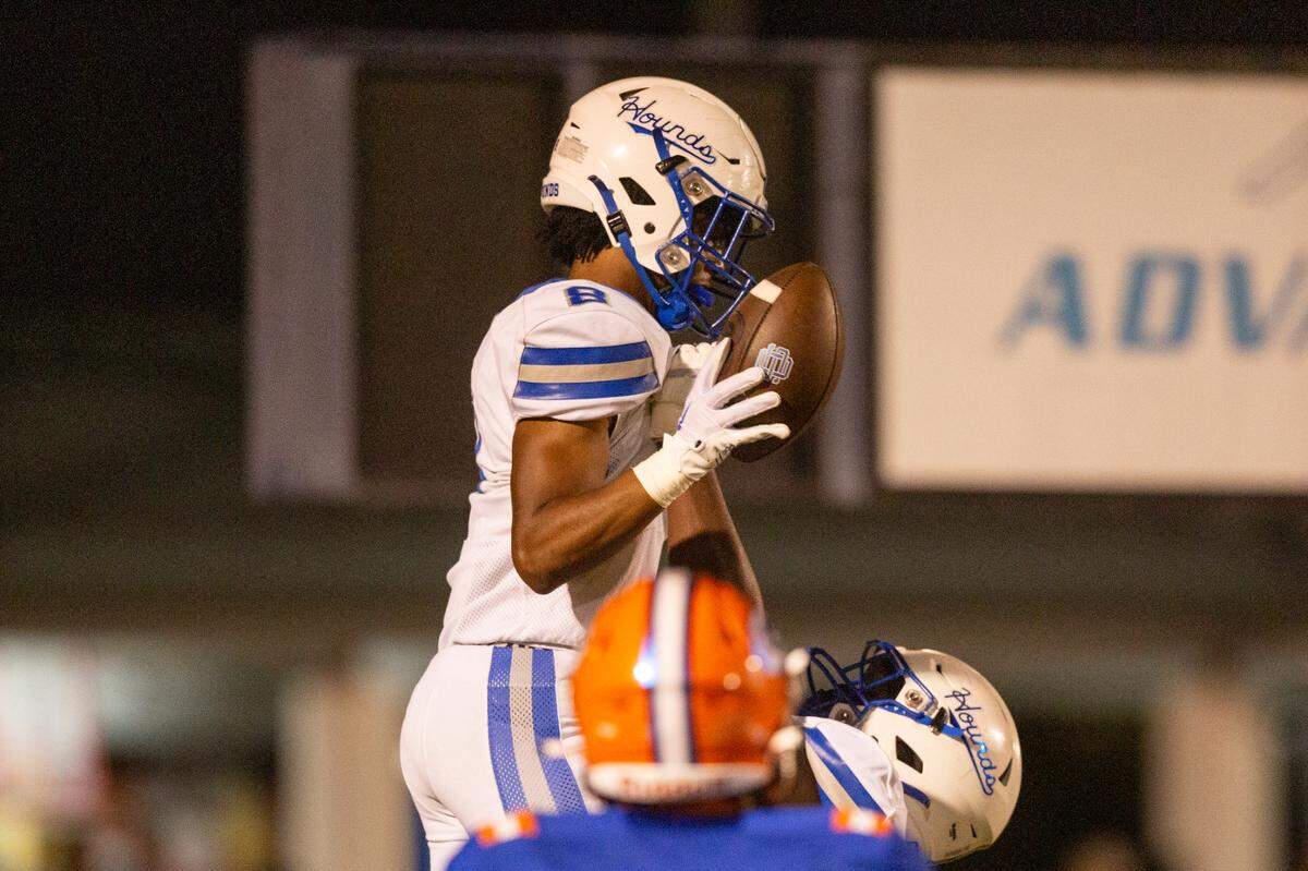 Ocean Springs’ Will Smith is lifted into the air by a teammate after scoring during a game against Gulfport at Milner Stadium in Gulfport on Friday, Oct. 27, 2023. Ocean Springs beat Gulfport 30-7.