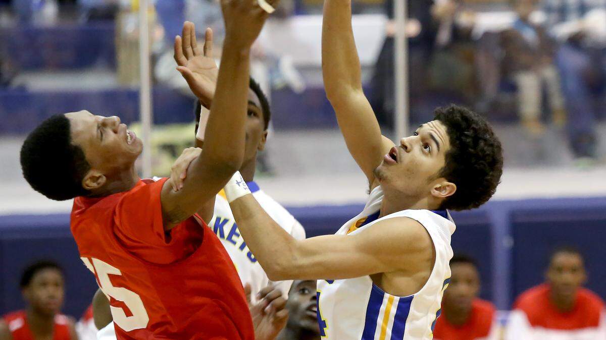 AMANDA McCOY/SUN HERALD 
 Biloxi's Marques McGee, left, and St. Martin's Stacee St. Julian battle last season at St. Martin High School.
