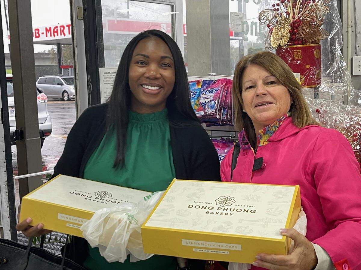 Patricia Lewis of Ocean Springs, left, and Lisa Lyons, right, were two of the 50 customers who lined up in time for a popular Dong Phuong Bakery king cake from New Orleans. They bought the king cakes at Lee’s International Market, one of two South Mississippi locations able to offer them this year. The other is Waveland Pharmacy.