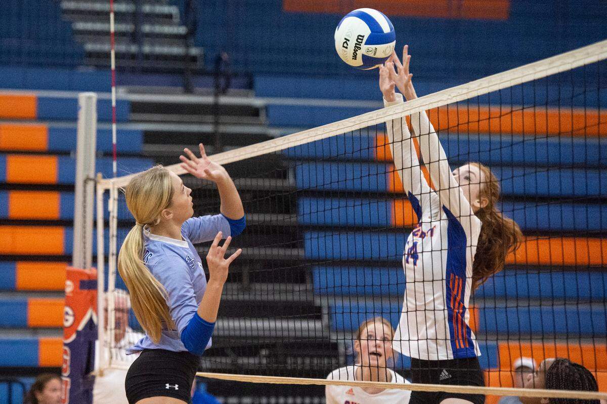 Gulfport’s Allie Hamric blocks the ball during a volleyball match against Ocean Springs at Gulfport High School in Gulfport on Tuesday, Oct. 4, 2022.