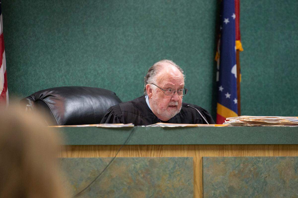 Judge Krebs talks to Moss Point police officer Eric Maye at Jackson County Circuit Court in Pascagoula on Thursday, March 24, 2022.