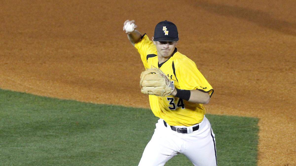 TIM ISBELL/SUN HERALD 
 Southern Miss second baseman Storme Cooper throws to first after fielding a ground ball against USA, Wednesday, March 2, 2016.