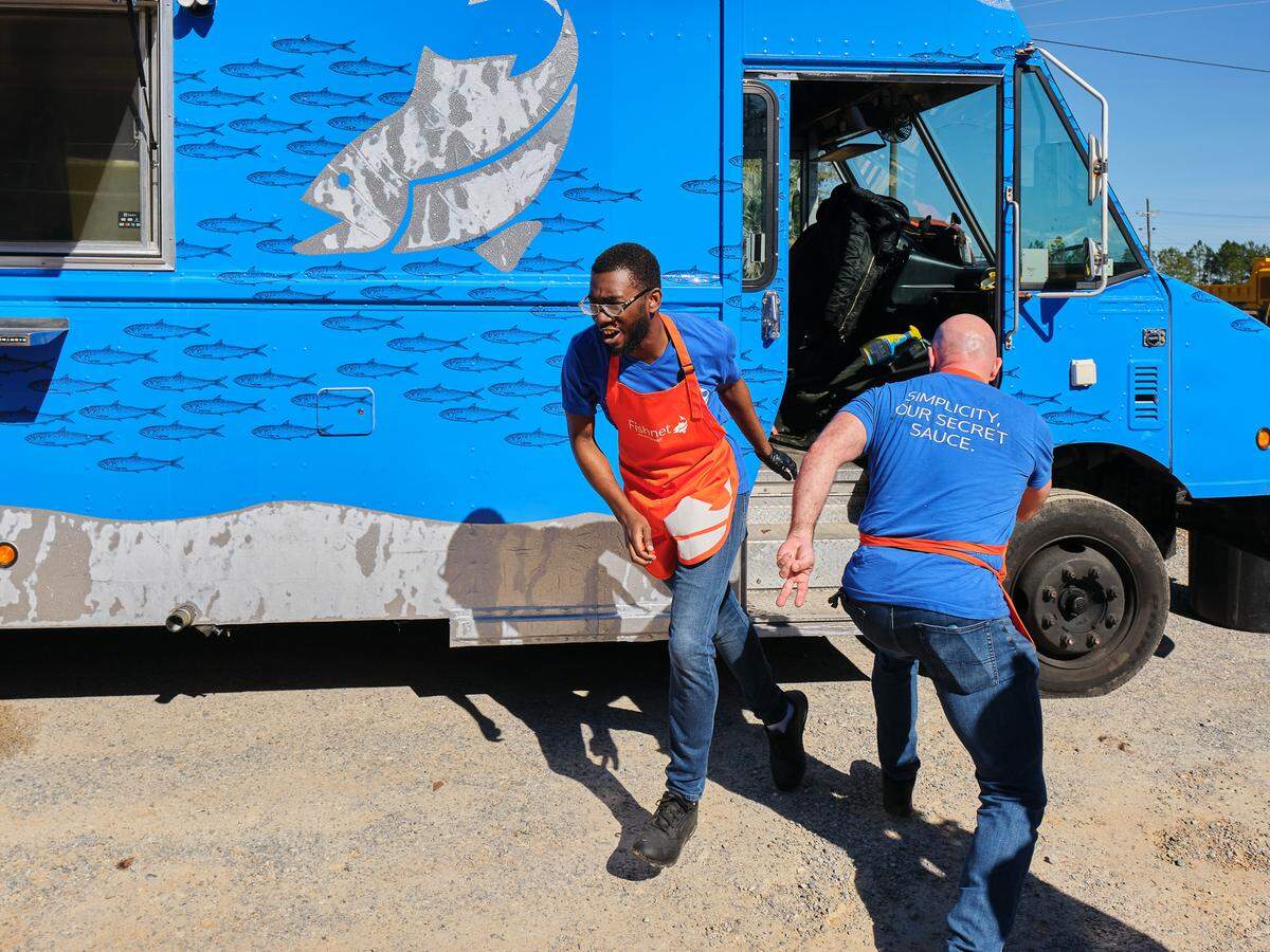The Fishnet team battles the clock during the Great Food Truck Race competition at The Shed in Ocean Springs.