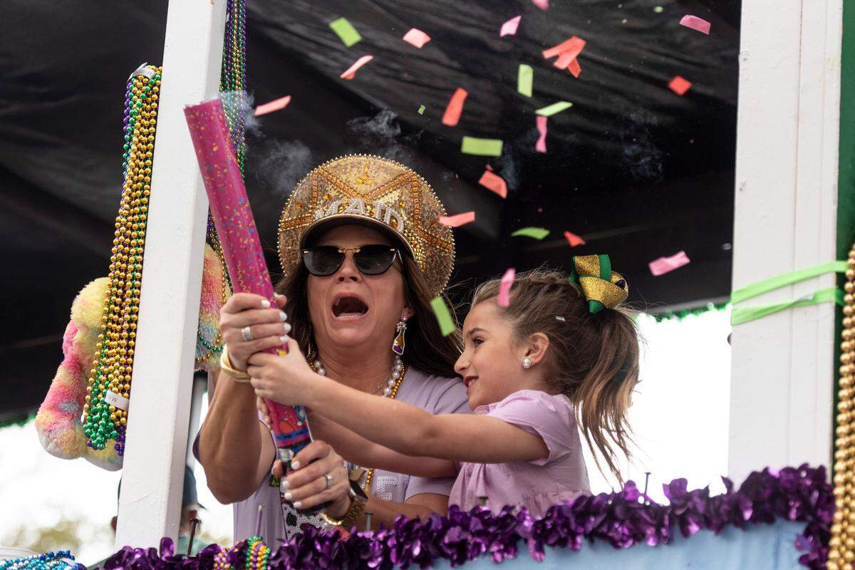 Float riders shoot confetti during the Gulf Coast Carnival Association Mardi Gras parade in Biloxi on Tuesday, March 4, 2025.