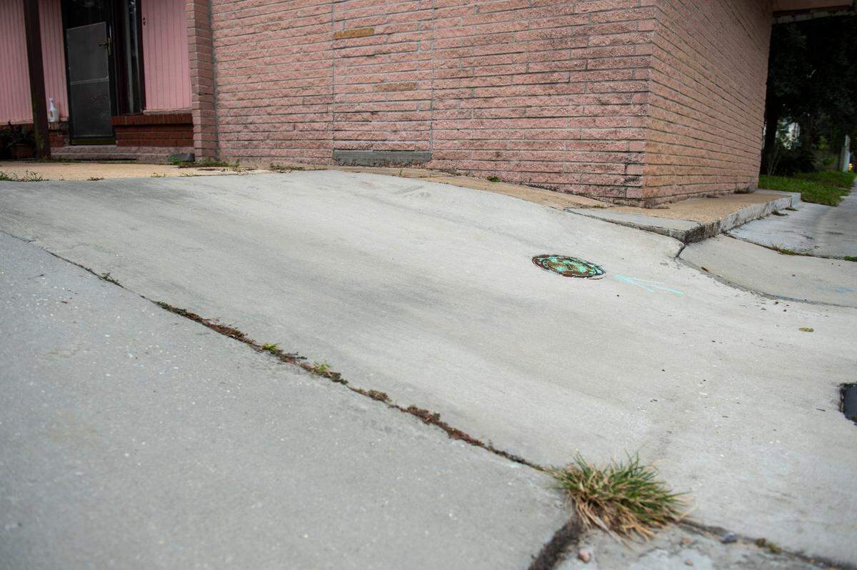 Sharon Whitson’s driveway outsider her home in East Biloxi on Friday, Oct. 29, 2021. Whitson says that Oscar Renda’s repairs made her driveway so steep it has caused her to fall.