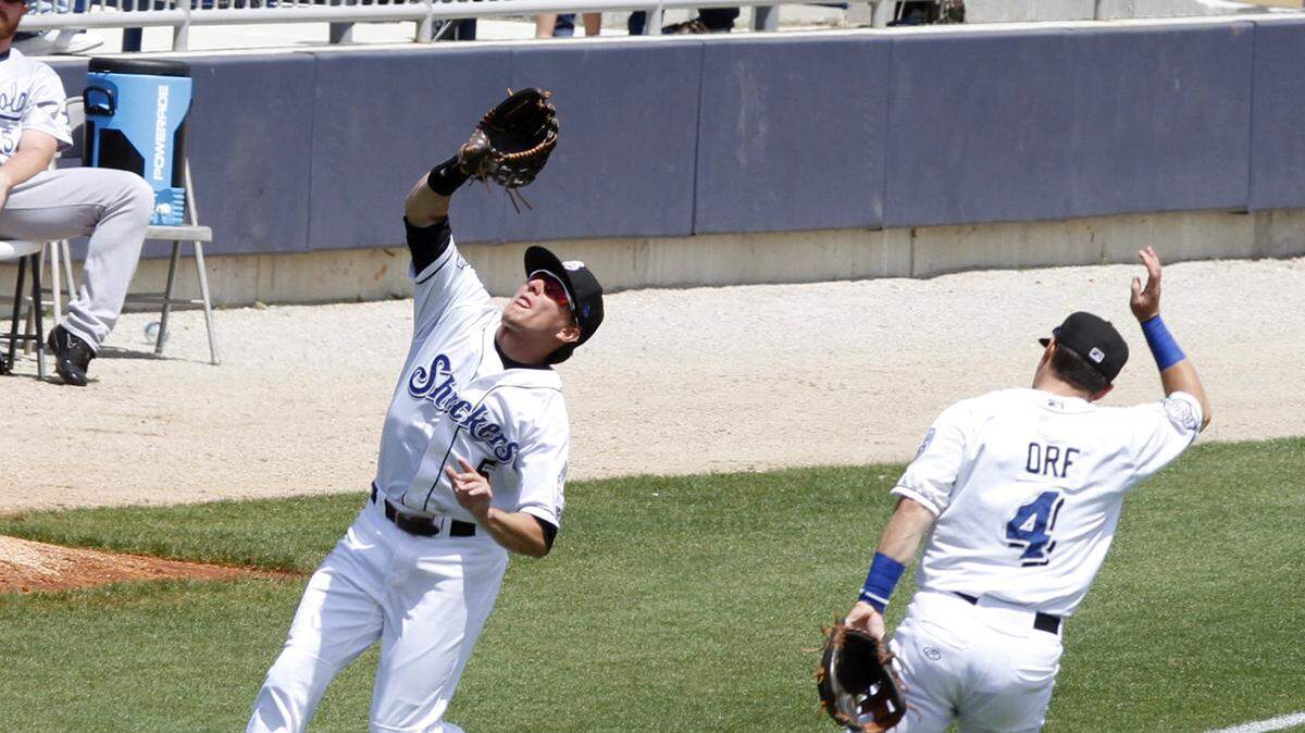 TIM ISBELL/SUN HERALD 
 Biloxi left fielder Kyle Wren catches a ball in foul territory as Nathan Orf gives ground, Sunday, Apr. 17, 2016.