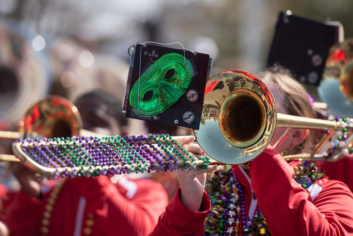 A member of Biloxi High School’s marching band during the Gulf Coast Carnival Association’s Mardi Gras parade in Biloxi on Tuesday, Feb. 13, 2024.