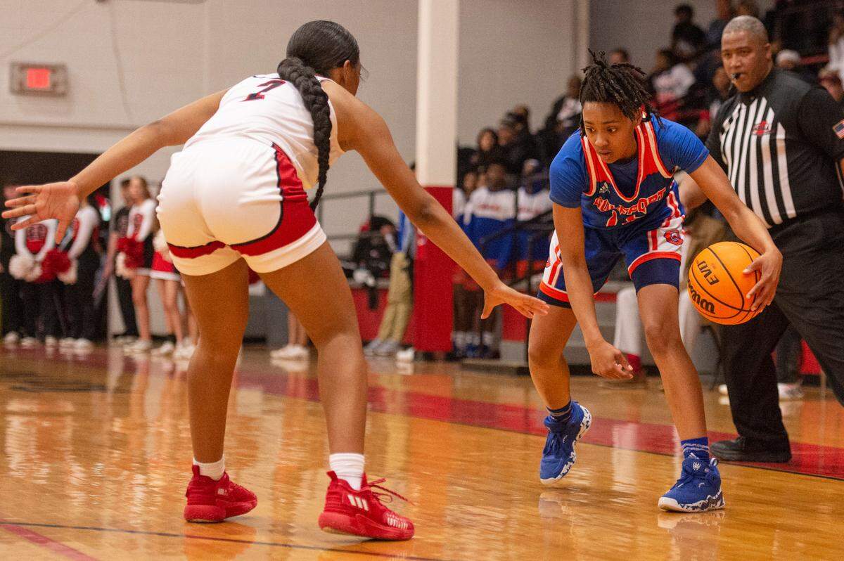 Gulfport’s Simaru Fields, right, keeps the ball away from Harrison Central’s Shaniya Whavers during a game against Harrison Central at Harrison Central High School in Gulfport on Friday, Feb. 4, 2022.