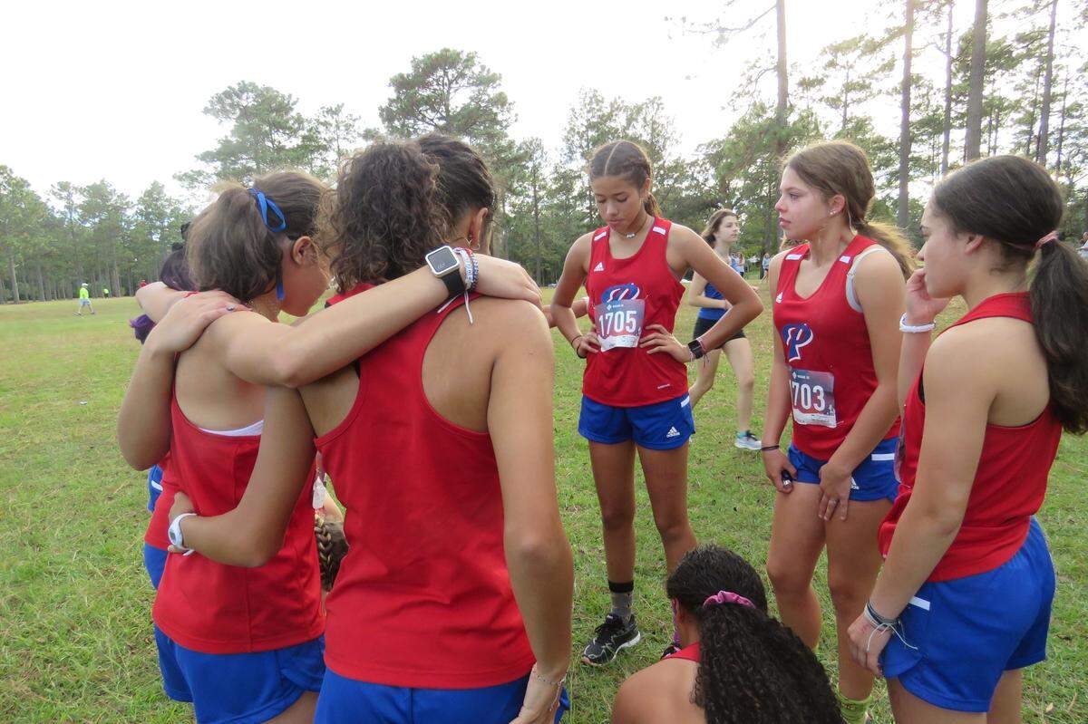 The Pascagoula High School girls’ cross country team stands at the starting line at the regional meet on Oct. 26, 2021.