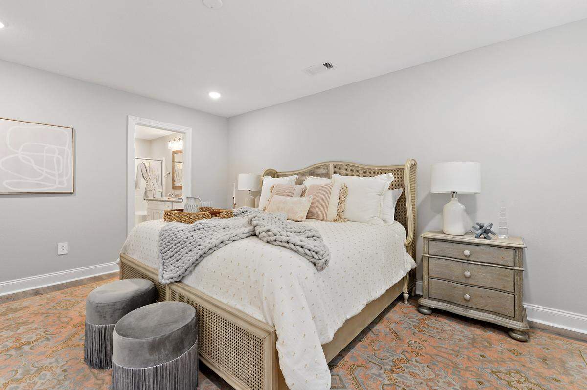An interior bedroom in a three-bedroom cottage, The Kai, built by Elliott Homes of Gulfport. The builder, known for quality construction, is no longer pre-selling homes but has cottages available in a number of subdivisions on the Mississippi Coast.