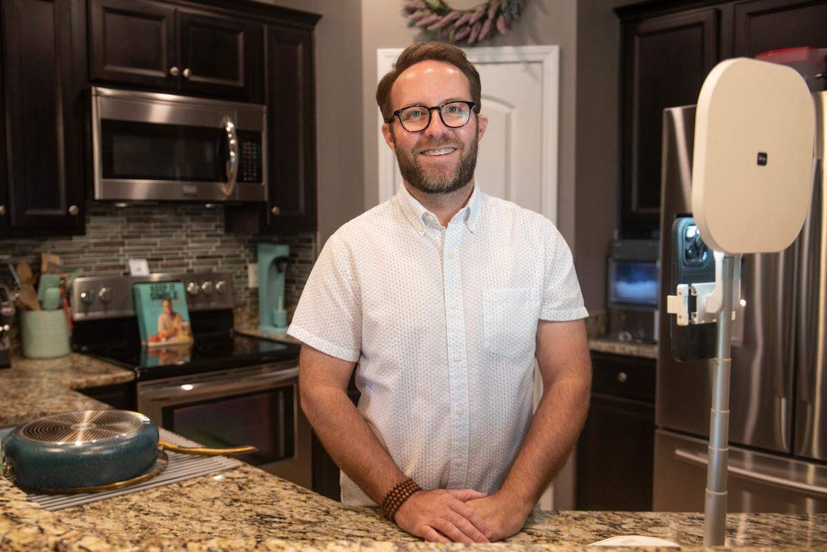 Matthew Bounds, also known as @yourbarefootneighbor on TikTok poses for a portrait in his kitchen where he films all his videos at his home in Gulfport on Friday, July 12, 2024.