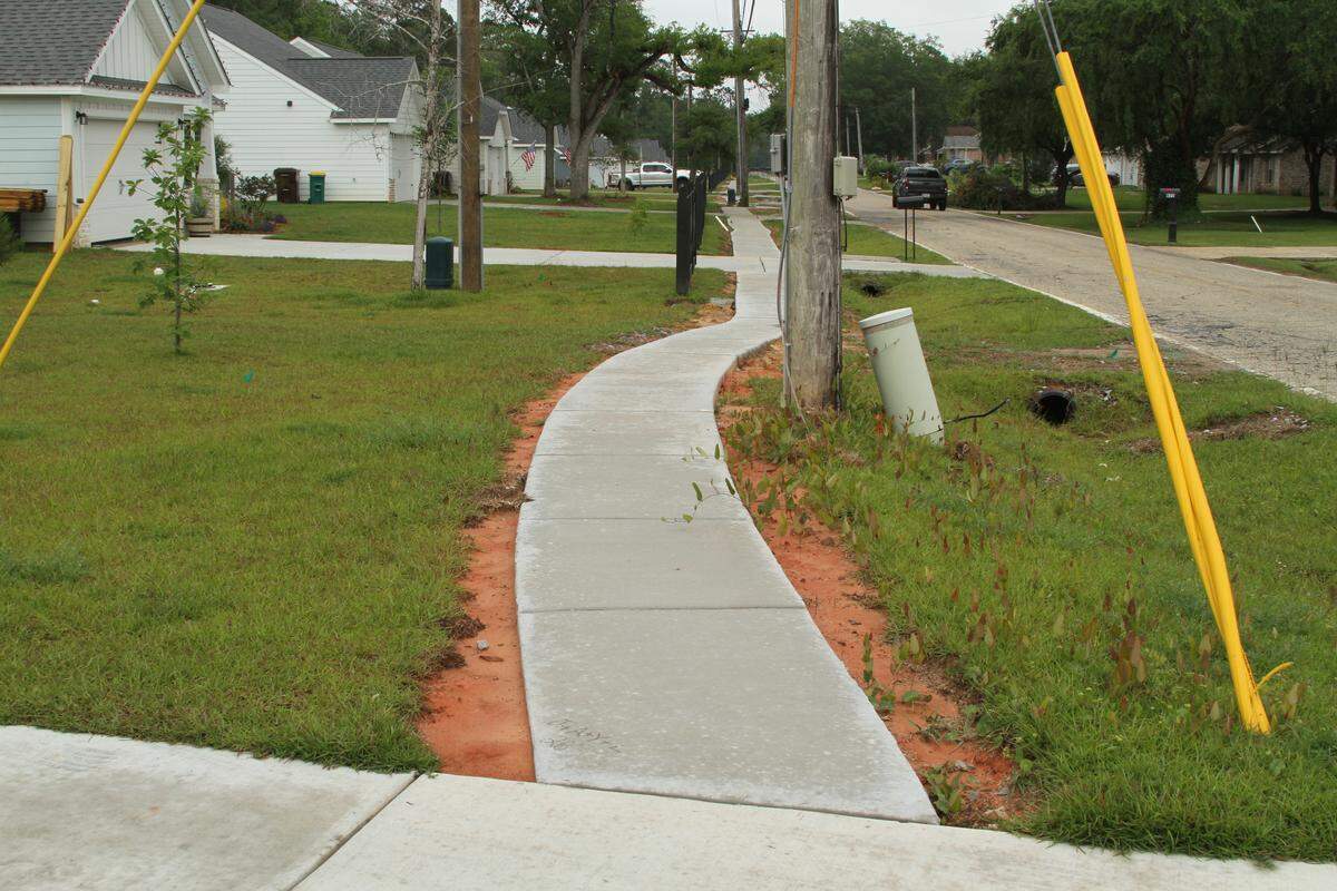 Sidewalks in the Hawk Creek subdivision were installed after the North Biloxi subdivision was built and are only 3 feet wide, although city regulations call for 4-foot-wide sidewalks, says community advocate and political commentator Jarrod Fusco.