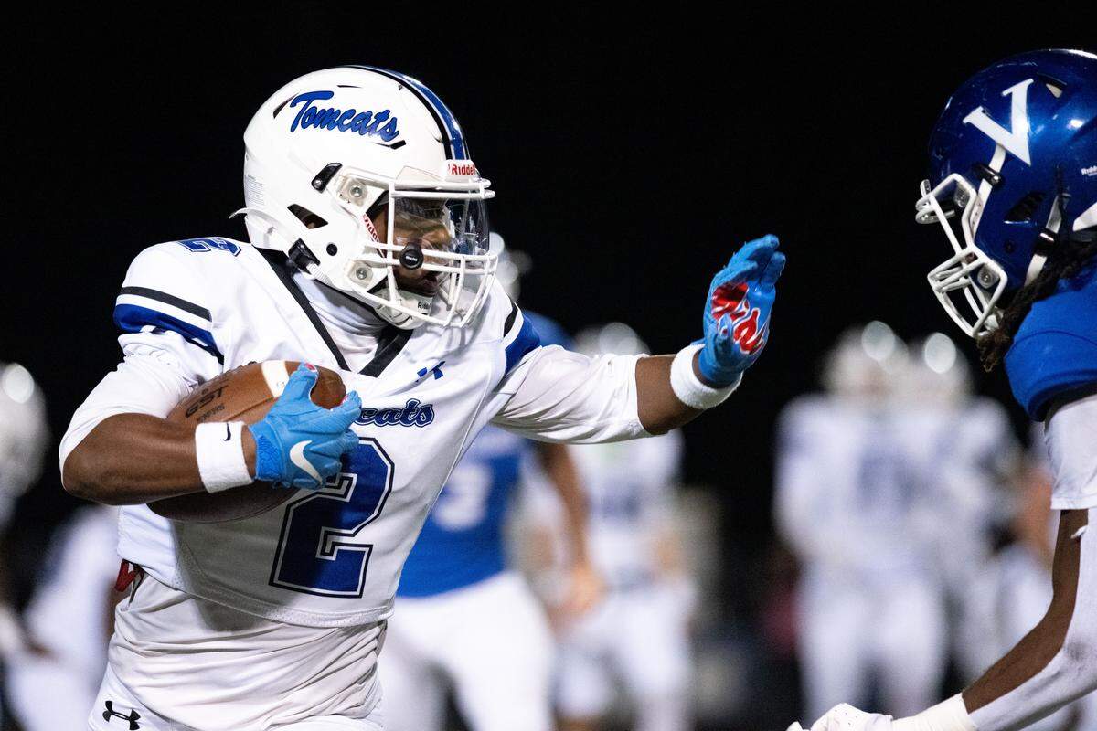 Stone wide receiver Jayden Collins (2) raises his arm to stiff arm a defender Friday in a win over Vancleave.