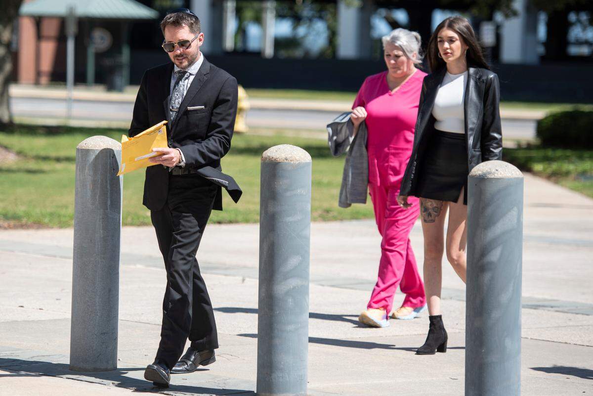 Robert Deming III and his girlfriend arrive at Dan M. Russell Jr. Federal Courthouse in Gulfport on Wednesday, May 1, 2024, for Deming to plead guilty to selling products containing synthetic cannabinoids at his Candy Shop kratom stores.