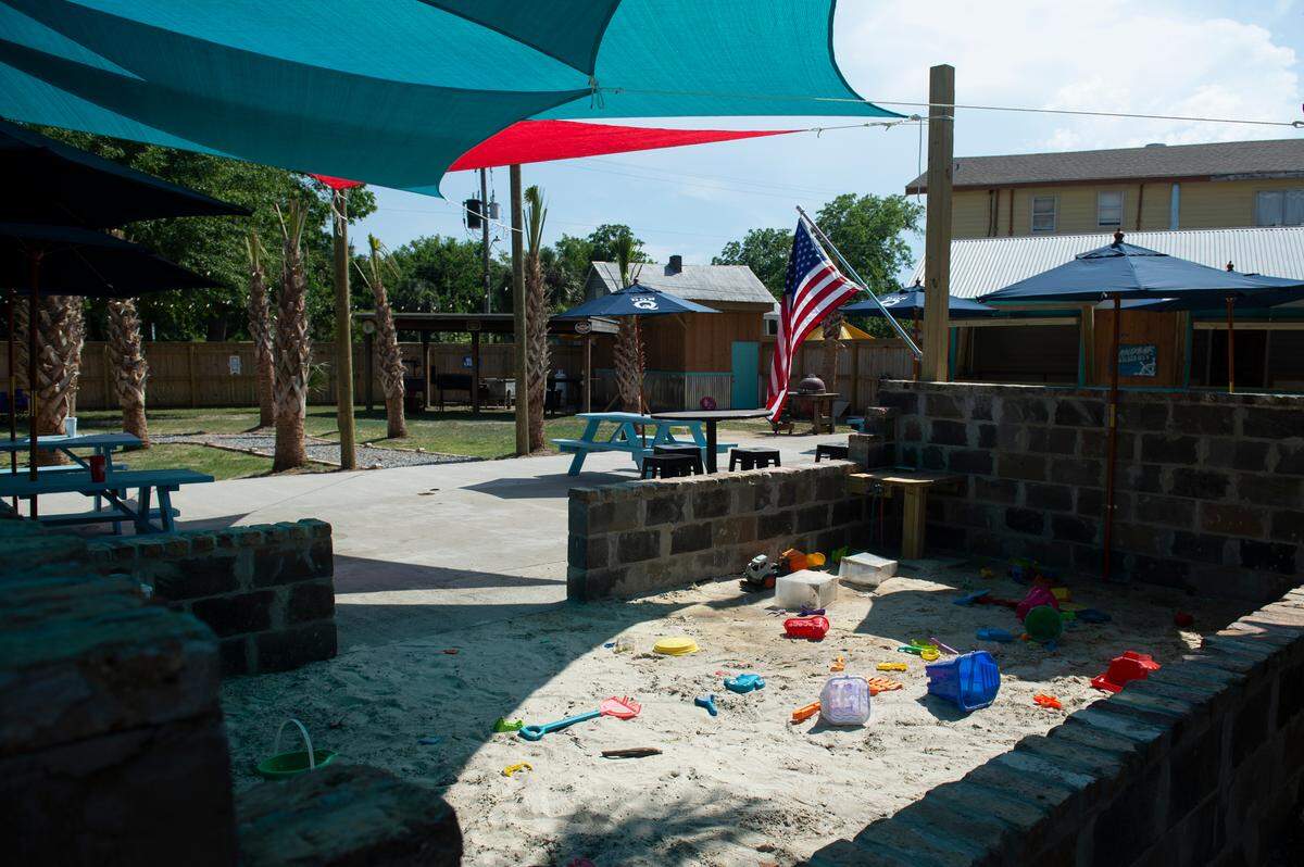 A sandbox will keep the kids happy at the new Back Yard new beer garden at TBT Depot District Deli and Seafood Market in Bay St. Louis.
