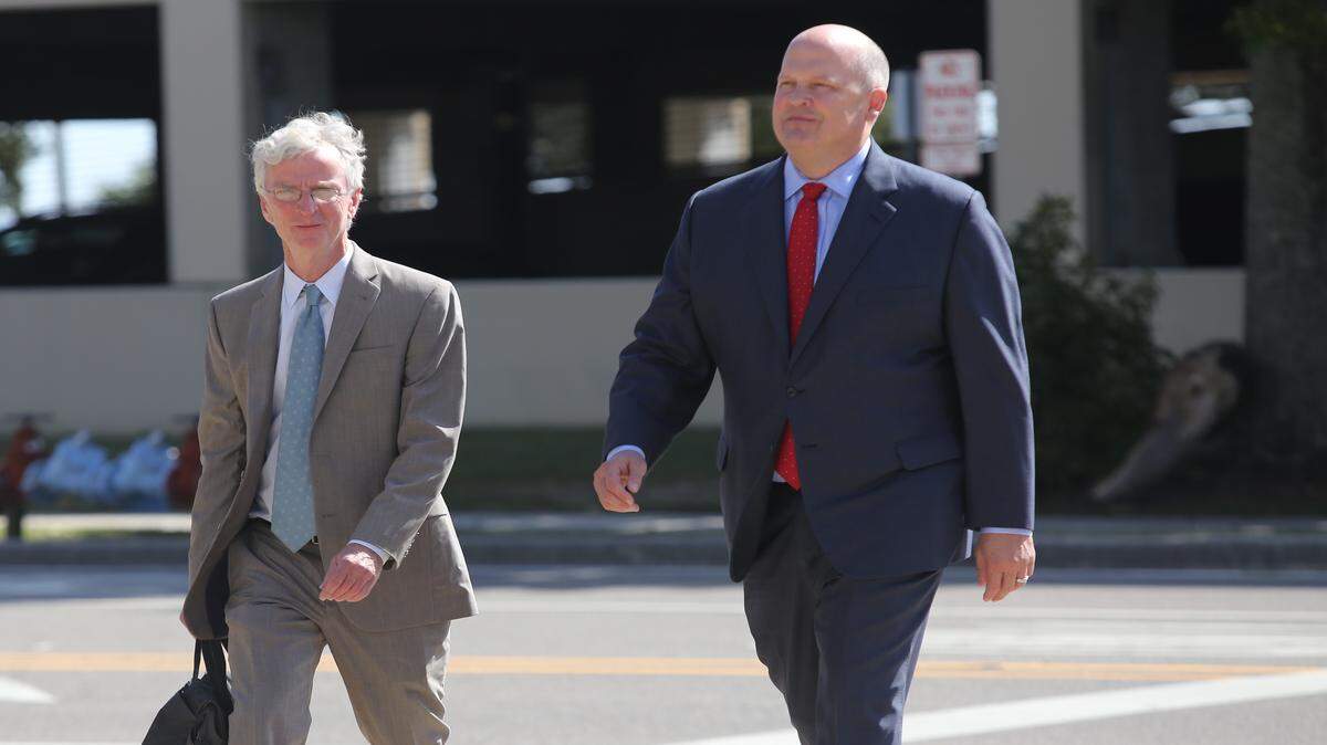 AMANDA McCOY/SUN HERALD 
 Mikal Watts, right, arrives at the federal courthouse in Gulfport with his attorney, Robert McDuff.