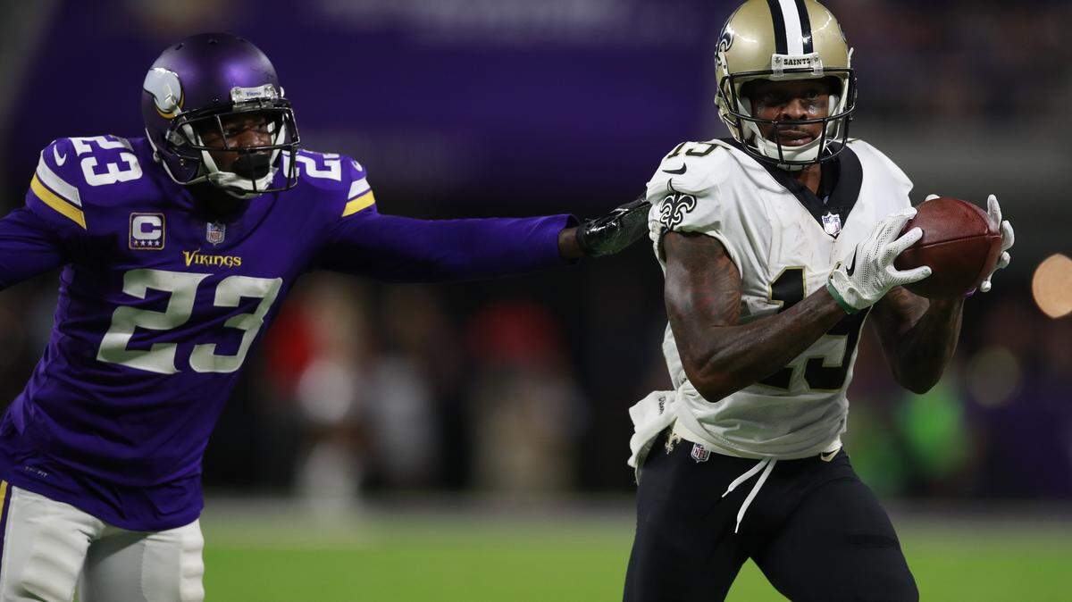 New Orleans Saints wide receiver Ted Ginn (19) makes a catch past Minnesota Vikings cornerback Terence Newman (23) during a game on Sept. 11, 2017, in Minneapolis.