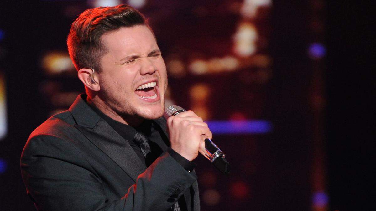 In this April 6, 2016 photo released by Fox, Trent Harmon performs on the singing competition series, "American Idol," in Los Angeles. The winner of the final seaon will be chosen on Thursday. (Michael Becker/FOX via AP)