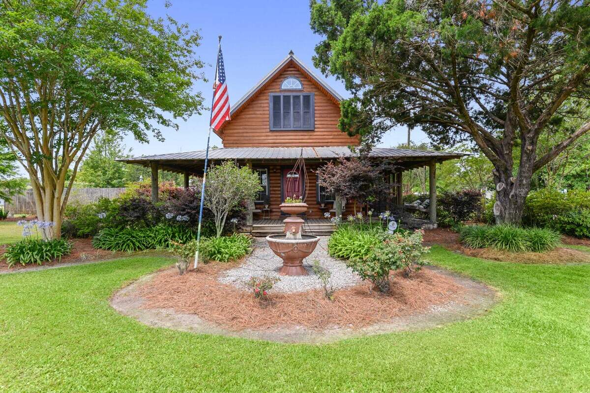 The Waveland home Breezy Porches got its name from the porch that wraps around the house, rebuilt in the footprint of the 1940s bungalow that originally sat there and was heavily damaged by Hurricane Katrina. Owners Glenn Hood and Charles Underwood also added a second story and a galvanized aluminum roof.