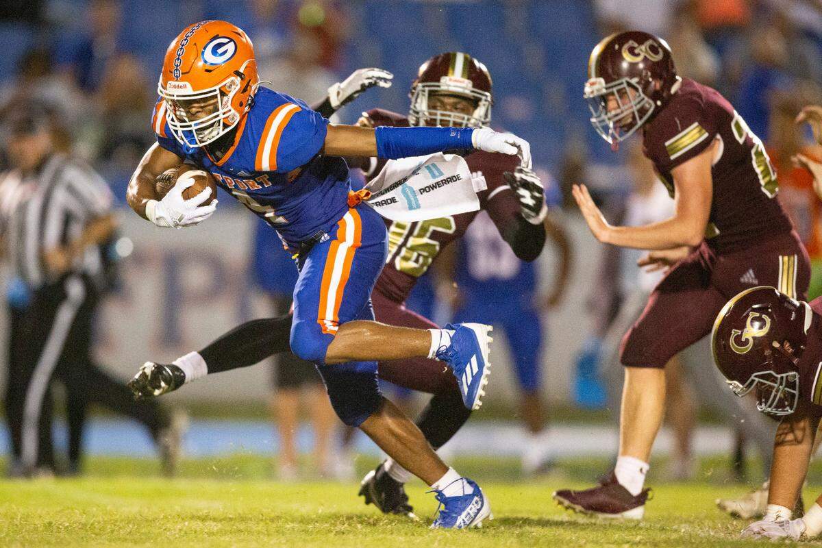 Gulfport’s Tavaris Henshaw spins around George County’s defense before breaking away to score a touchdown during a game against George County at Milner Stadium in Gulfport on Friday, Aug. 26, 2022.