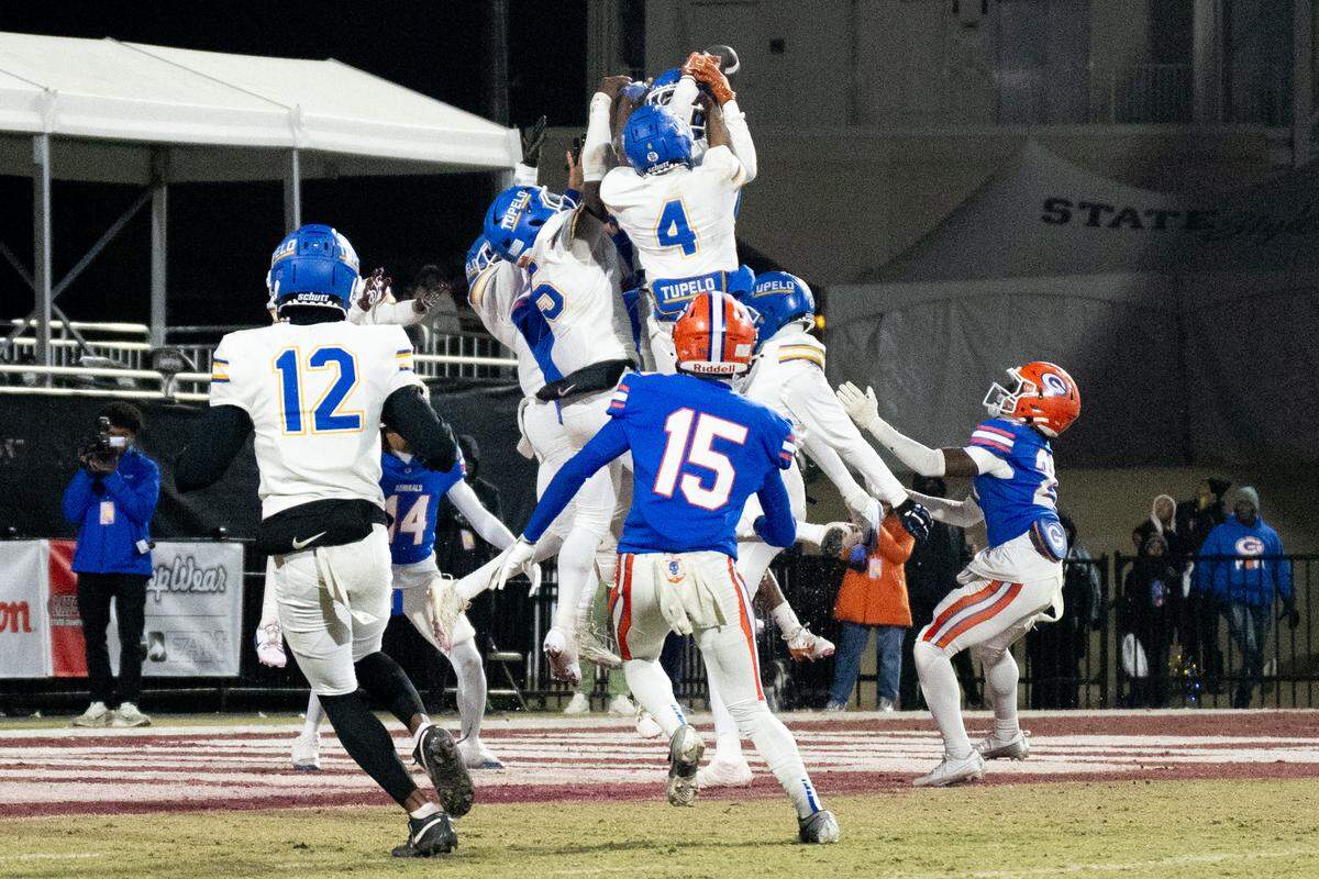 Tupelo defenders deflect the ball as Gulfport wide receiver Mylan Stubbs (21) reaches out to catch it and clinch the Admirals’ win over Tupelo.
