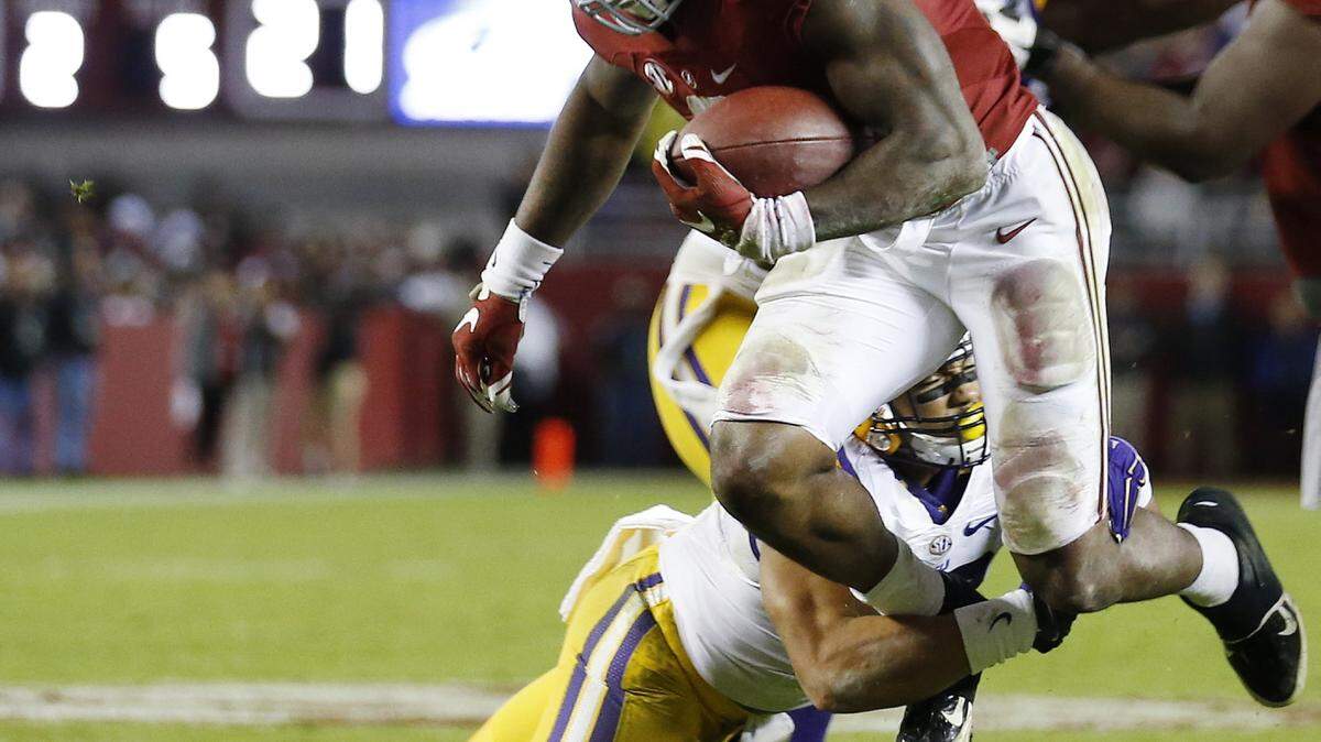 Alabama running back Derrick Henry (2) is hit by LSU linebacker Duke Riley (40) in the second half of an NCAA college football game Saturday, Nov. 7, 2015, in Tuscaloosa , Ala. (AP Photo/John Bazemore)