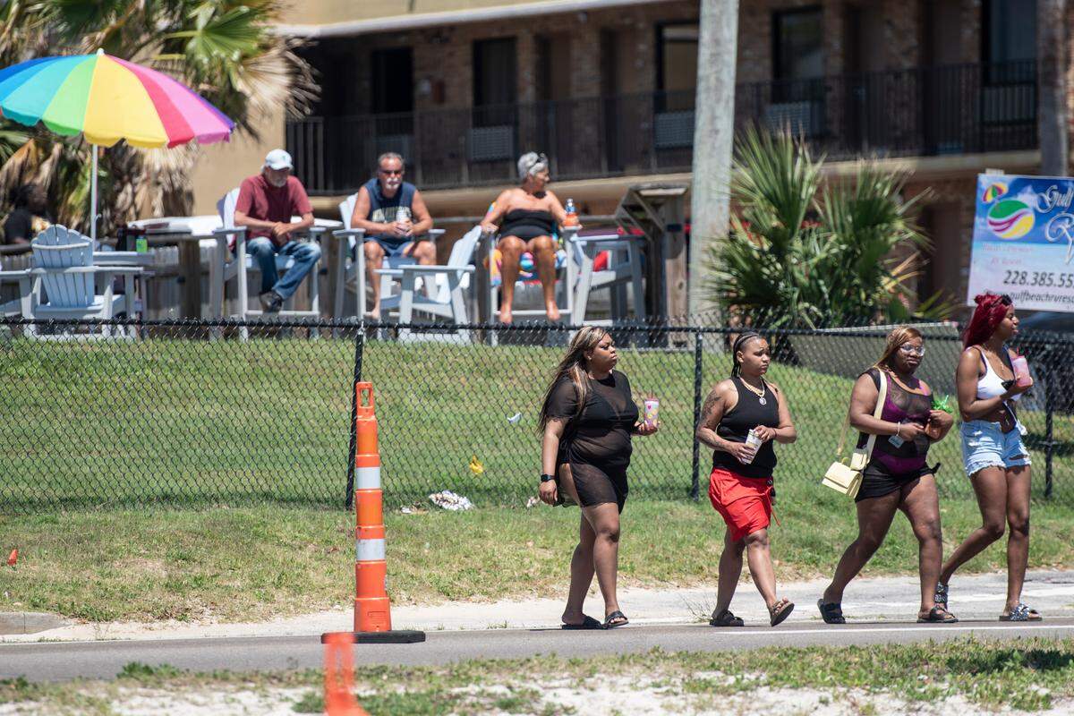 Spring breakers cross Highway 90 in Biloxi to get to the beach during Black Spring Break on Saturday, April 13, 2024. The city of Biloxi denied a special events permit in part because of safety concerns.